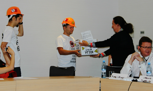 Activists handing over the petition at the EBRD's consultation meeting on its energy sector strategy