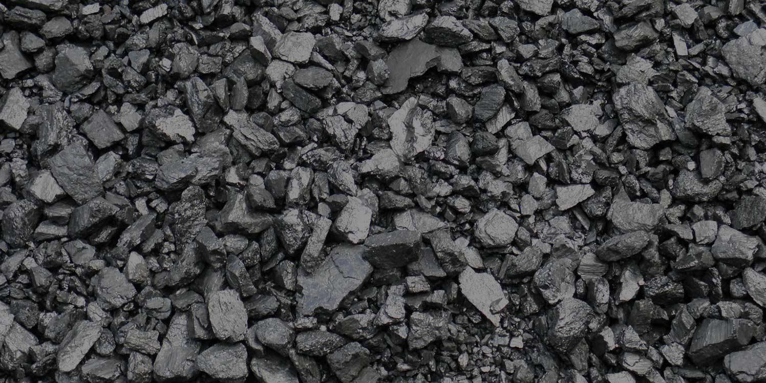 Big and small pieces of coal seen from above.